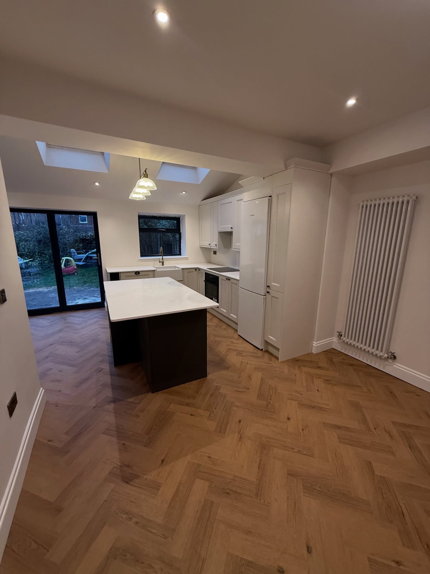 Open-plan kitchen-diner extension with island and skylight