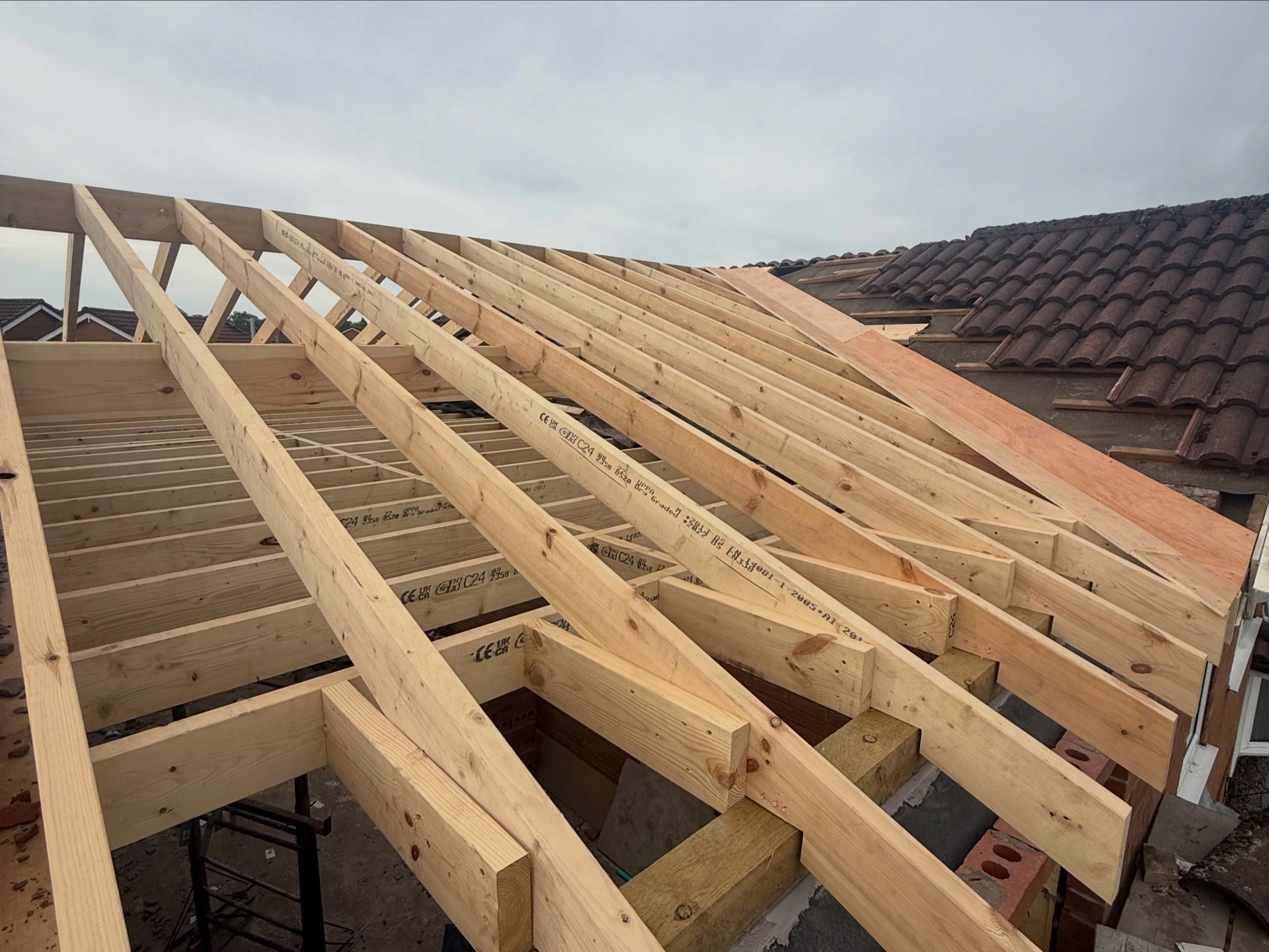 Drone view of a loft conversion in progress with new timber trusses