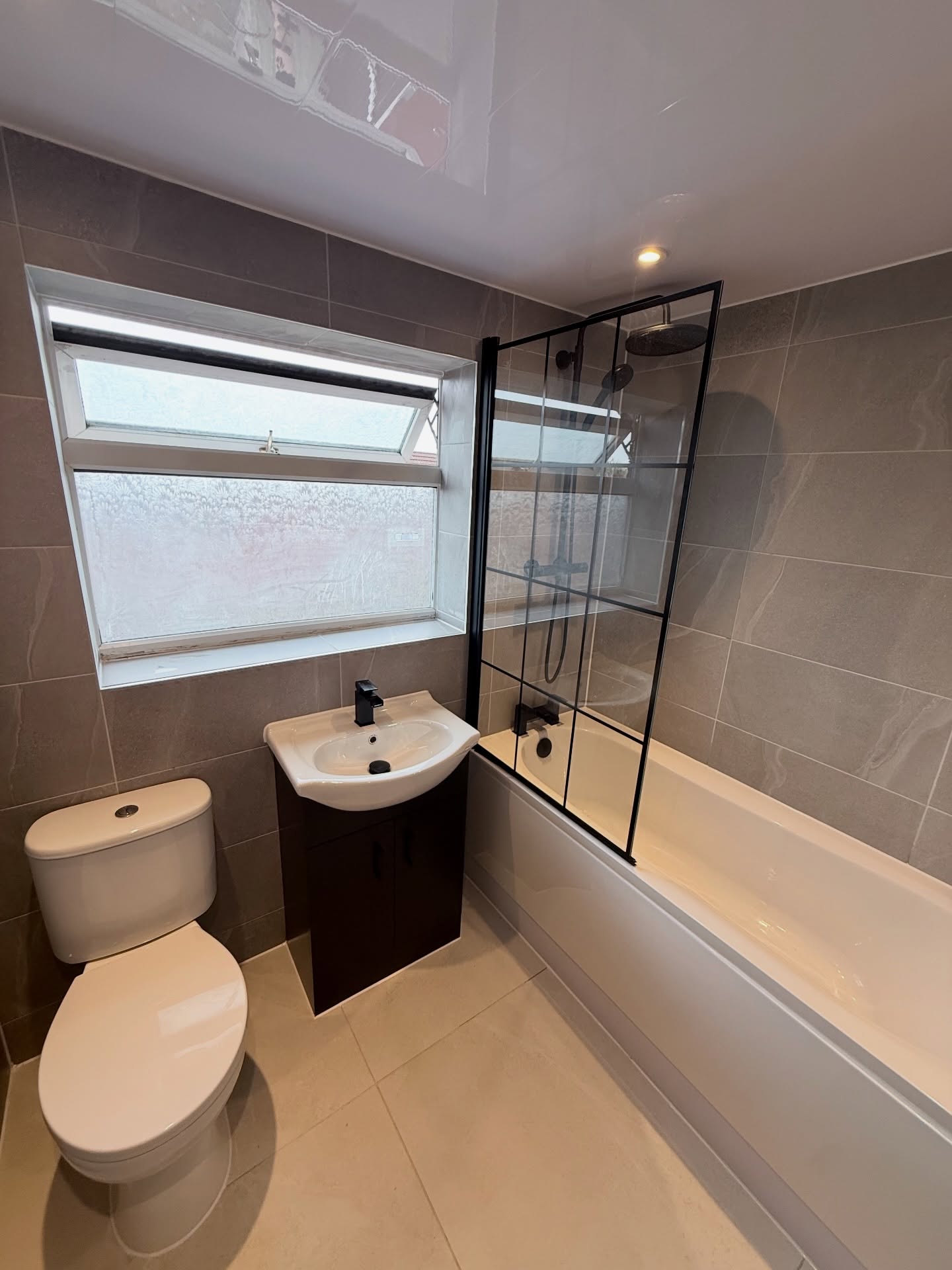 Refurbished family bathroom with bath-shower and basin